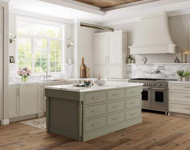 cropped green island with off white cabinetry