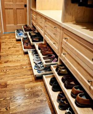 oak cabinetry with roll out shoe racks